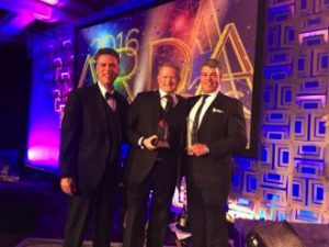 Karma Group CEO Gary Knowles accepts the award on behalf of the Karma Group at ARDA 2016, in Hollywood, Florida