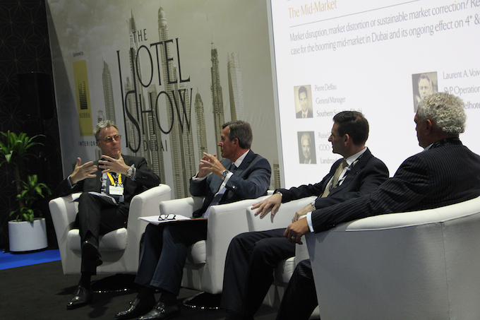 Laurent A. Voivenel (far left) joins a panel discussion at The Hotel Show