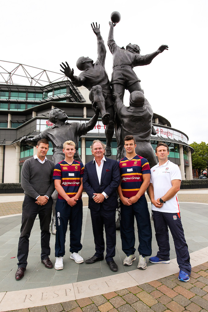John Spence (centre) poses with Brighton College players and staff at the Core Values statue at Twickenham